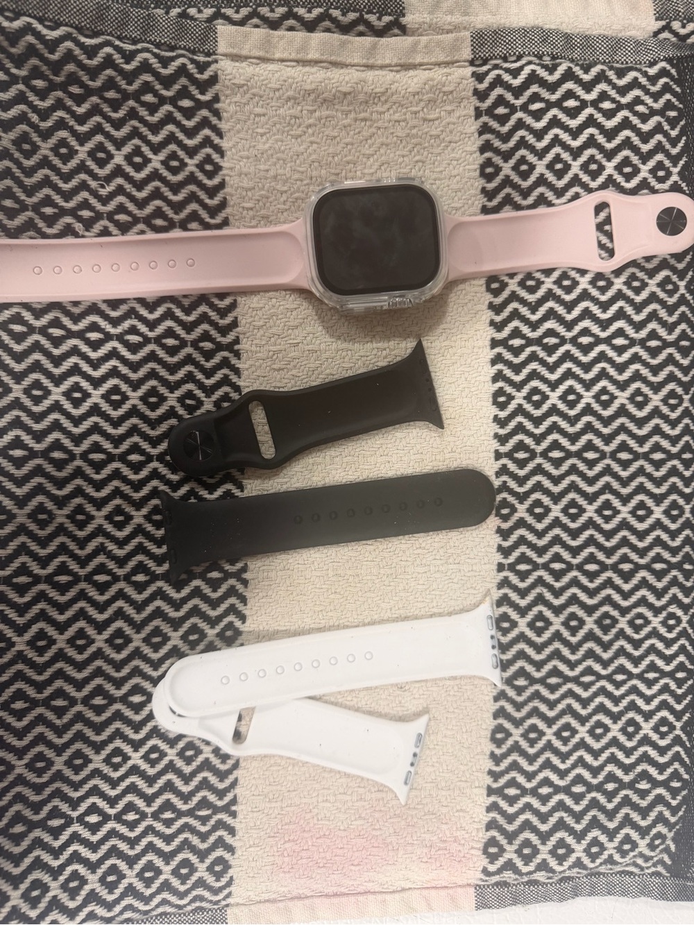 Pink Smartwatch with Extra Black and White Silicone Bands